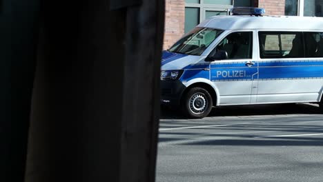 Side-view-of-a-German-police-van-parked-near-the-crime-scene-of-the-shooting-in-Mainz-on-March-22nd-2022