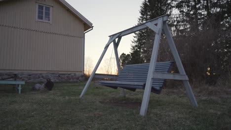 Old-wooden-swing.-Rural-landscape
