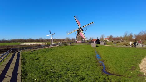 POV-Walking-Towards-Spinning-Windmill-At-Holiday-Park-Molenwaard