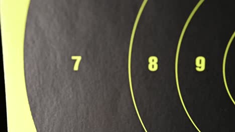 slow-left-to-right-slide-over-a-high-visibility-modern-gun-target-numbers