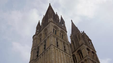 Abbey-of-Saint-Étienne--towers-low-angle.-Cloudy-sky