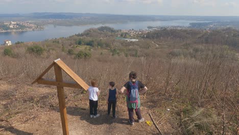 Family-at-Motta-Grande-panoramic-viewpoint-over-Maggiore-lake-for-children-sightseeing,-Italy