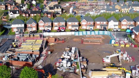 Construction-site-aerial-view-above-new-urban-real-estate-housing-development-regeneration-dolly-left