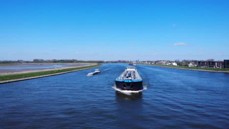 Aerial-View-Of-Inland-Tank-Barge-Sailing-At-Noord-River-In-Hendrik-Ido-Ambacht,-Netherlands