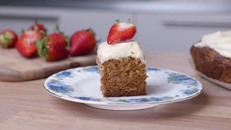 Portion-Of-Baked-Carrot-Cake-With-Fresh-Sliced-Strawberry-On-The-Top---close-up