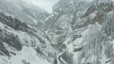 Aerial-of-beautiful-snow-covered-valley-with-a-river