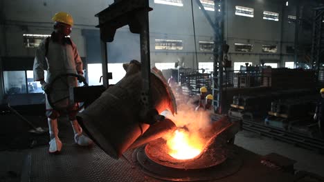 Furnace-with-red-hot-metal-workpieces-in-foundry