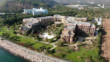 Disneyland-Explorer's-lodge-Hotel-and-park-in-Hong-Kong-empty-and-closed-for-visitors-due-to-covid19-lockdown-guidelines,-Aerial-view