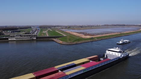 Ship-Carrying-Intermodal-Containers-In-River-Noord,-Netherlands