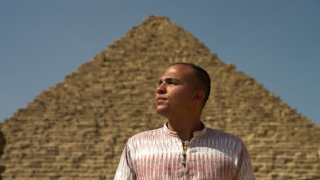 Man-In-Front-Of-Small-Pyramid-In-Giza-Cairo,-Egypt---close-up