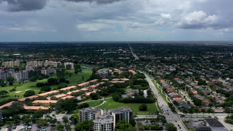 A-high-angle,-aerial-view-over-a-suburban-neighborhood-in-Florida-during-a-cloudy-day