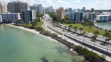 Aerial-drone-flight-to-the-start-of-Gulf-Stream-drive-after-exiting-John-Ringling-Causeway-in-beautiful-Sarasota,-Florida,-USA