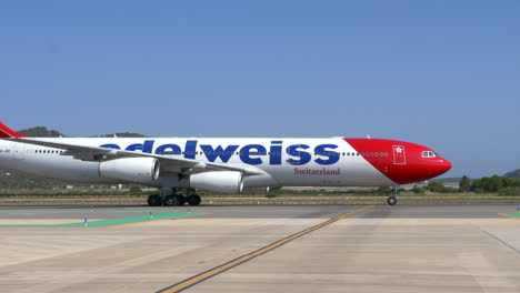 Big-long-haul-aircraft-from-Swiss-airline-Edelweiss-on-taxiway-at-Ibiza