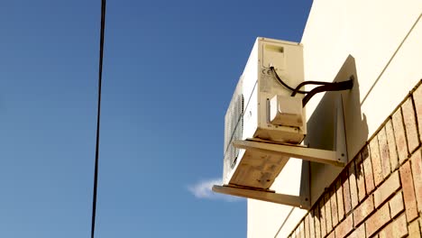 Timelapse-Of-An-Airconditioning-Unit-Outside-With-Clouds-Dancing