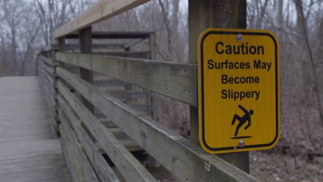 Caution-Surfaces-May-Become-Slippery-Sign-on-Bridge