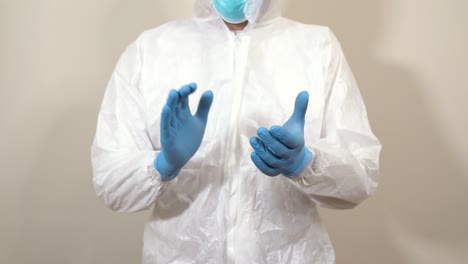 doctor-in-ppe-suit-clapping-in-front-of-the-camera