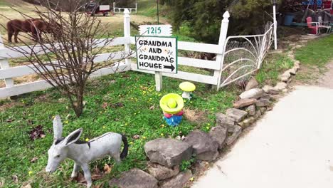 Sign-to-Grandma-and-Grandpa's-house-with-Horse's-in-the-background