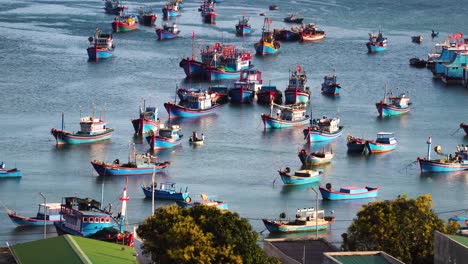Traditional-blue-fishing-boats-in-harbor-in-Vinh-Hy-Bay,-Vietnam