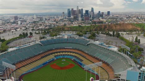 Backwards-aerial-view-of-Downtown-Los-Angeles-and-Dodgers-Stadium