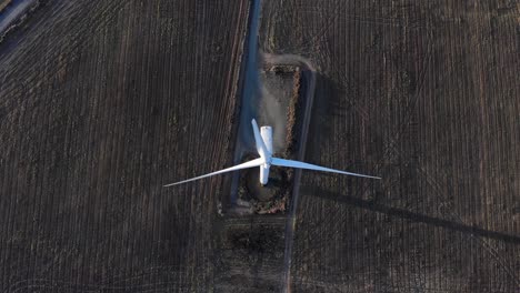 Top-Down-View-Of-Windmill-On-The-Field---aerial-drone-shot