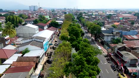 Urban-water-channel-in-green-belt-in-middle-of-street,-Magelang-city,-Indonesia