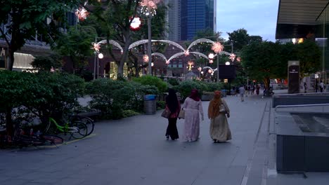 Group-of-Muslim-women-walking-on-Ochard-road-,-Christmas-light-up-,-Singapore