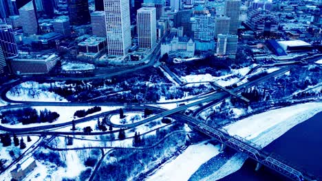 Winter-aerial-eve-flyover-vintage-iron-Low-Level-Bridge-with-4-truss-design-built-1900-connecting-the-downtown-area-to-the-South-side-of-Edmonton-on-Connors-and-Scona-Rd-NW-over-the-snowy-river-4k1-2