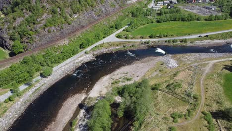 Aerial-view-of-famous-salmon-river-at-Dalekvam---flowing-beside-railway-between-Bergen-Voss-and-Oslo