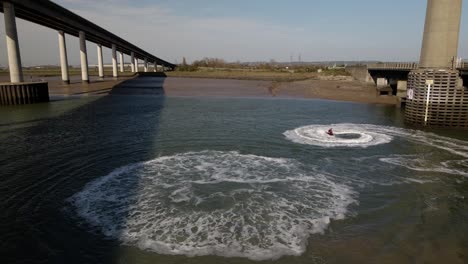 Jet-Ski-Circling-Around-On-The-Swale-River-In-Sittingbourne,-UK-At-Summer