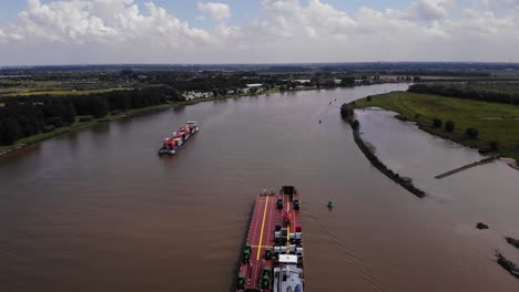 Aerial-Above-Dynamica-Barge-Navigating-Along-Oude-Mass-Near-Another-Cargo-Ship