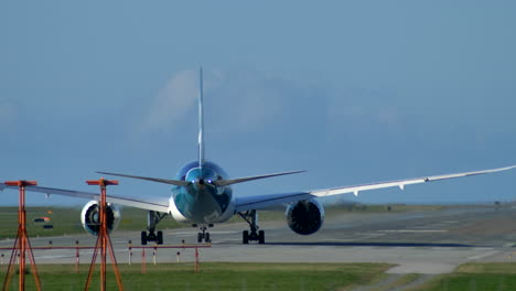 A-Long-Haul,-Wide-Body-Airplane-Lining-Up-on-the-Runway,-Sunny-Day