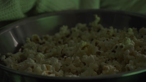 Close-Up-Of-Woman-Hand-Taking-Popcorn-From-Bowl