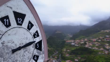 Epic-aerial-view-of-Our-Lady-of-Fatima-Chapel-clock-tower-in-Madeira-island,-Portugal