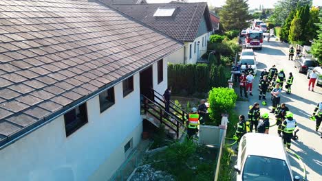 AERIAL---Firefighters-after-attending-to-a-fire-in-Oberwaltersdorf,-Austria