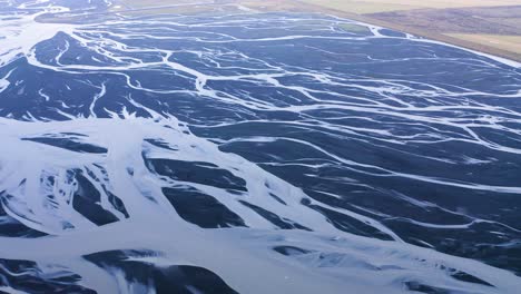 Cinematic-aerial-shot-of-iced-Markarfljo-t-River-Delta-during-bright-sunny-day-in-Iceland