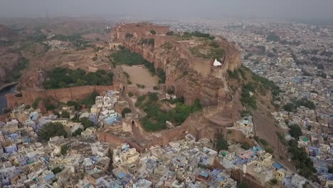 Historic-Mehrangarh-Fort-perched-high-above-Blue-City,-Jodhpur,-India