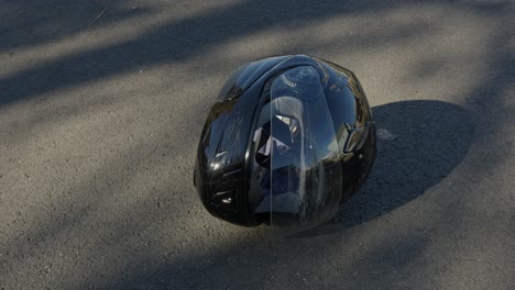 Wide-Pan-Right-of-a-Damaged-Motorcycle-Helmet