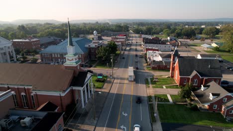 Shepherdsville-Kentucky-aerial-with-churches-in-foreground-flying-toward-the-courthouse