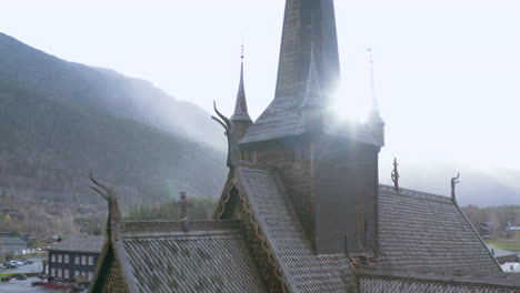 Adventurous-View-of-Lom-Stave-Church-While-Raining-With-Misty-Background-in-Norway