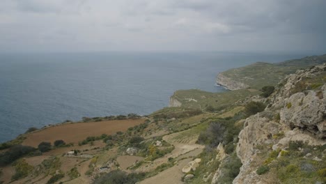 Scenic-panorama-of-a-typical-mediterranean-landscape-on-the-island-of-Malta-with-the-sea-merging-with-the-sky-on-the-horizon