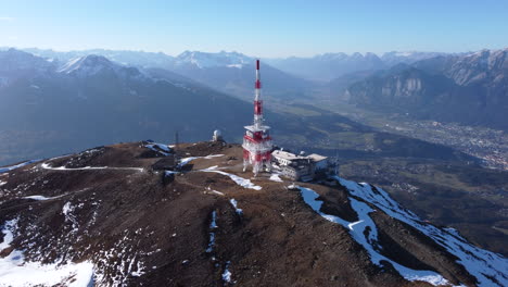 Aerial-circling-Patscherkofel-ski-resort-on-sunny-day,-Innsbruck