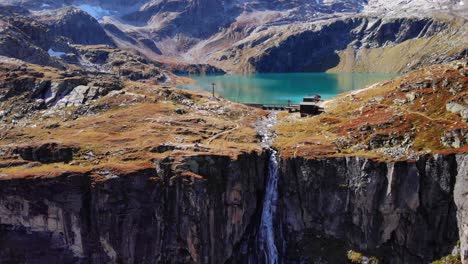 Waterfall-Flowing-Down-On-Mountain-Cliff-From-Weisssee-Reservoir-In-Austria