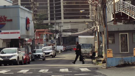 Tracking-shot-of-a-man-walking-through-Panama-City-in-Central-America