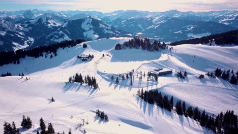 Aerial-view-of-People-Skiing-and-snowboarding-on-hill,-Ski-Resort