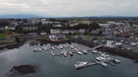 Aerial-view-of-Ardglass-marina-and-town-on-a-cloudy-day,-County-Down,-Northern-Ireland