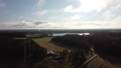 Drone-shot-rising-over-fields-and-forests-in-Oulanka-National-Park,-Finland