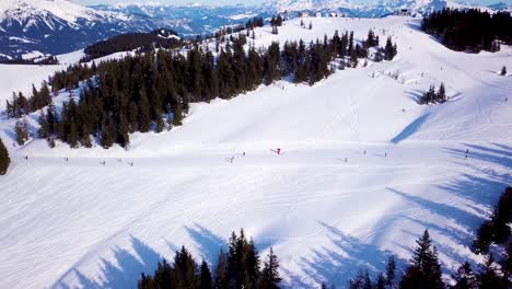 Aerial-view-of-the-ski-lift-at-the-foot-of-the-ski-slope-with-a-crowd-of-skiers-and-snowboarders