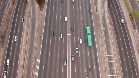 Aerial-drone-4K-footage-of-hundreds-of-different-vehicles-driving-across-the-giant-multi-lane-Pan-American-highway