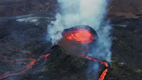 Hot-Lava-and-Magma-boiling-in-the-Crater-of-Fagradalsfjall-volcano-in-Iceland---orbiting-drone-shot