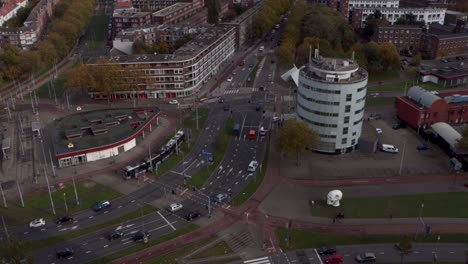 Cars-and-public-transport-on-a-busy-intersection-in-Rotterdam,-the-Netherlands